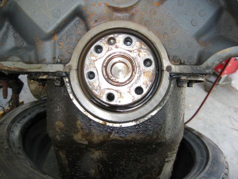1969 Ford F-250 - This image shows the crankshaft seal area of an engine block, with visible oil and grime.