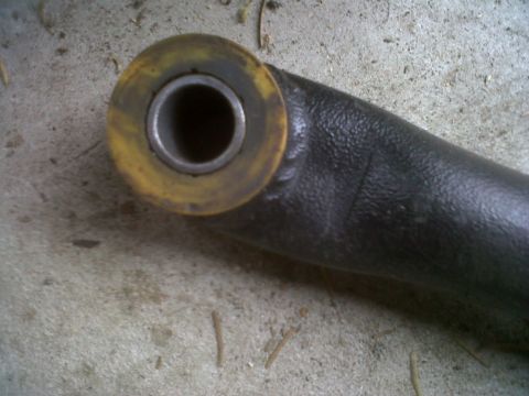 1978 Ford Bronco - This is a close-up of a vehicle suspension part, a yellow bushing.