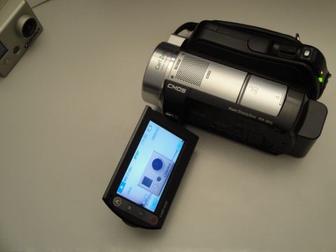 1993 Ford Taurus - Two digital cameras, a GoPro and a Sony Handycam, are placed on a flat surface.