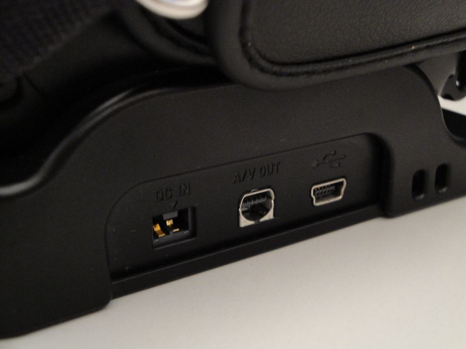 Camera ports labeled DC IN, A/V OUT, and USB