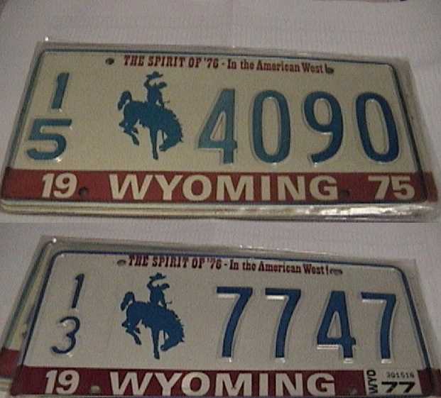 Two vintage Wyoming plates, 15 4090 from 1975 and 13 7747 from 1977, in chrome frames