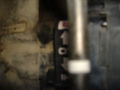 1989 Yamaha MOTO-4 - Close-up of a gear shifter with directional arrows and numbered positions.