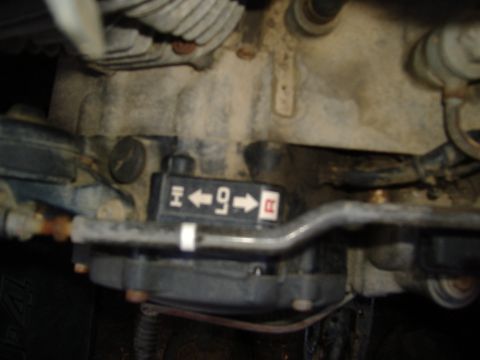 1989 Yamaha MOTO-4 - Close-up of a gear selector mechanism showing H, 4, 9, and R markings.