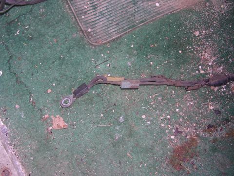 1978 Ford Bronco - Close-up of an automotive wiring harness lying on a carpeted floor.