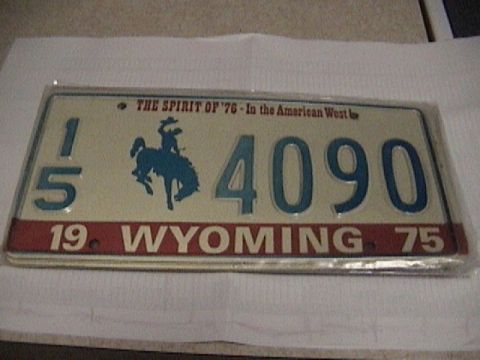 1995 Ford Bronco - Wyoming license plate from 1975, the state's cowboy logo and 'The Spirit of '76' slogan.