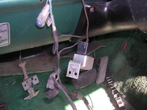 1978 Ford Bronco - Close-up of the under-dash area showing electrical components and pedals.