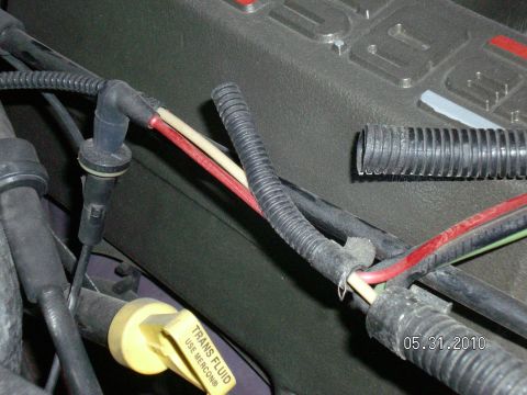 1996 Ford Bronco - Engine bay wiring detail with transmission fluid dipstick visible.