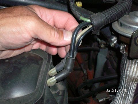 1996 Ford Bronco - Close-up of vacuum hoses in an engine bay, with a date stamp of 05.31.2010.