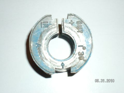 1996 Ford Bronco - This alignment bushing has markings for 'IN', 'OUT', '+', and '30°'.