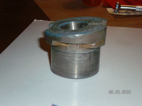 1996 Ford Bronco - Close-up of a metal bushing part with visible wear and markings.