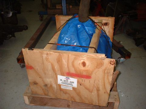 1956 Ford Crown Victoria - A Ford M-6010-A460 cylinder block is secured within a wooden crate, ready for transport or storage.