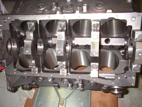 1956 Ford Crown Victoria - Engine block with crankshaft bearing saddles and main caps visible.