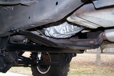 2000 Ford F-150 - The underside of a vehicle is shown, focusing on the transmission and exhaust components.