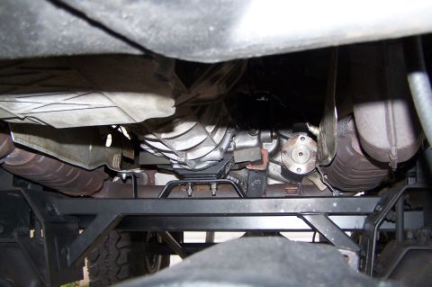 2000 Ford F-150 - The underside of a vehicle shows the transmission and drivetrain components, with a watermark visible.