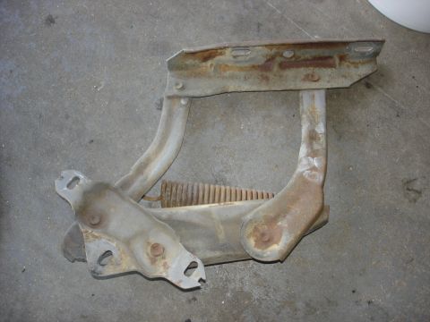 1979 Ford F-250 - This is a rusted hood hinge assembly with a visible spring, possibly from a truck.