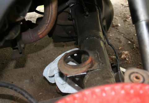 1976 Ford Ranchero - Undercarriage view shows suspension parts and exhaust system, with a rag placed on the axle.
