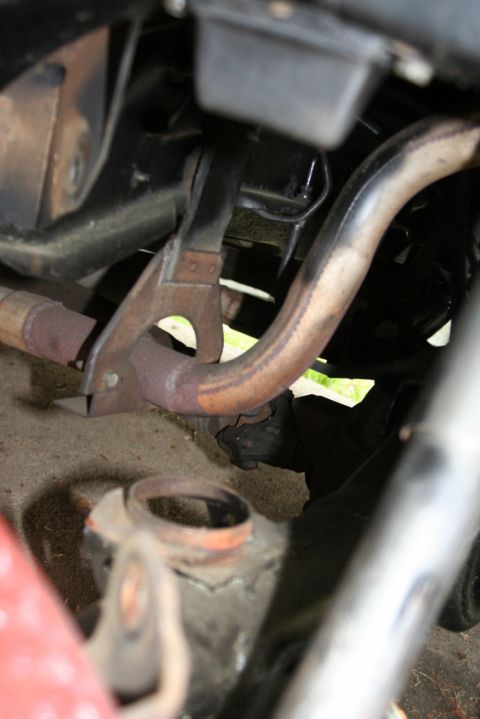 1976 Ford Ranchero - Underside view of vehicle exhaust and suspension parts, showing rust.