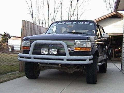 1995 Ford Bronco - Front view of a 1995 Ford Bronco equipped with a bull bar and auxiliary lights.