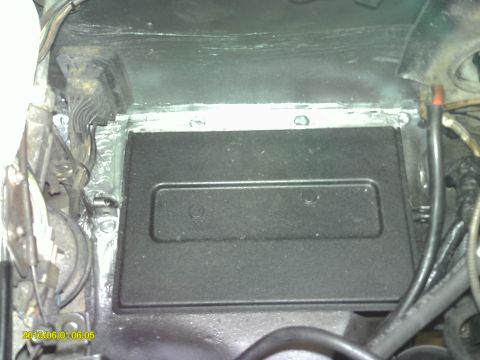 1987 Jaguar XJ6 - Took out battery tray, removed rust and refinished with truck bed liner from aerosol can. Silicone sealer in the seams.