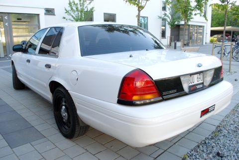 1998 Ford Crown Victoria - This 1998 Ford Crown Victoria is shown from the rear quarter angle, parked on a patterned paved surface.