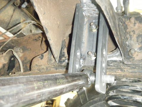 1978 Ford Bronco - A close-up view of a custom suspension component and linkage, showing metal fabrication and hardware.