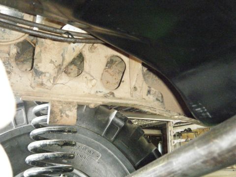 1978 Ford Bronco - Close-up view of the suspension and tire on a 1978 Ford Bronco.