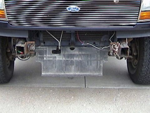 1995 Ford Bronco - Front view of a 1995 Ford Bronco showing the grille, bumper, and undertray details.