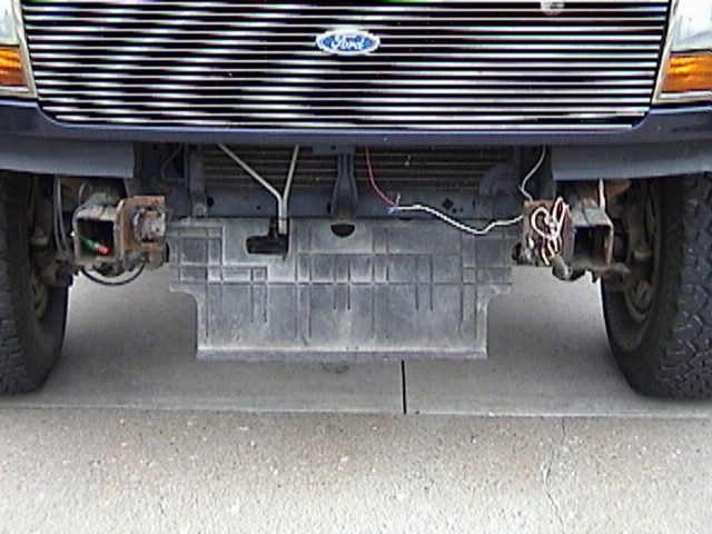 1995 Ford Bronco front grille with Ford logo, exposed bumper mounts, and plastic undertray