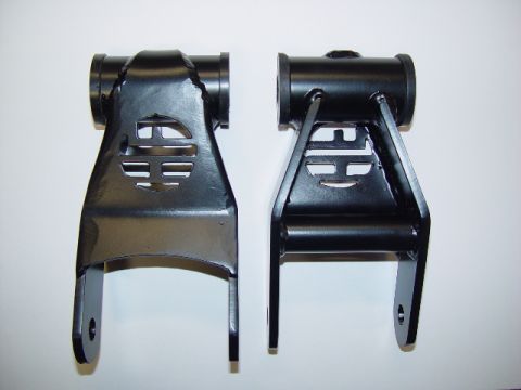 1993 Ford Bronco - Two black metal automotive suspension components are shown against a white background.