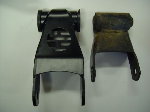 1993 Ford Bronco - Comparison of a new black suspension part and an old rusty one.