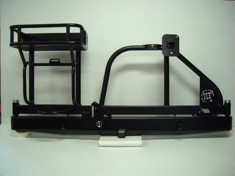 1993 Ford Bronco - Aftermarket rear bumper and tire carrier assembly with integrated storage rack and swing-away arm.