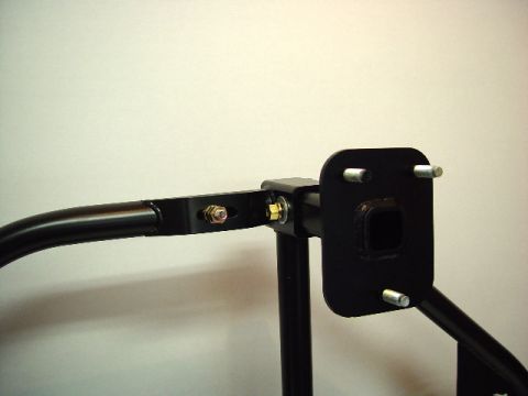 1993 Ford Bronco - Aftermarket rear bumper swing-away tire carrier mount shown with hitch receiver opening.