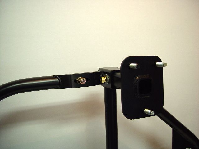 Aftermarket rear bumper swing-away tire carrier mount with hitch receiver opening