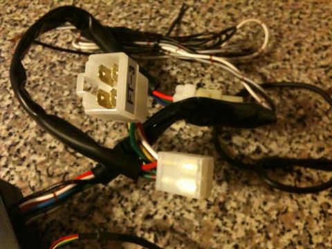 2005 Subaru Impreza - A close-up view of a vehicle wiring harness, multiple connectors and colored wires.