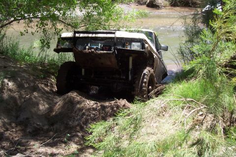 1981 Ford F-150 - This 1981 Ford F-150 is deep in the mud, partially submerged in a river.