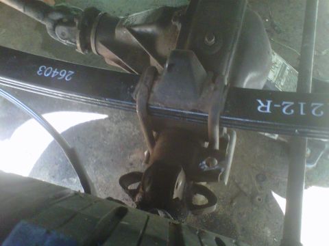 1981 Toyota Hilux - Close-up view of a vehicle's rear axle and leaf spring assembly, showing stamped part numbers.