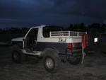 1991 Ford Bronco - This two-tone 1991 Ford Bronco features a removable top and doors, suggesting it's ready for off-road adventures.