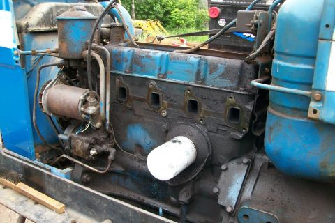 2000 Chevrolet Tahoe - This is a close-up view of an engine, likely from a tractor or older vehicle, showing the oil filter and surrounding components.