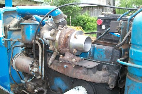 2000 Chevrolet Tahoe - Close-up view of a vehicle's engine compartment, highlighting a turbocharger and associated plumbing.