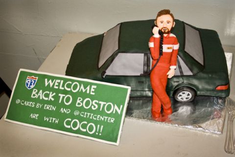 1993 Ford Taurus - Cake decoration depicting a figure, a car, and a welcome sign for Boston.