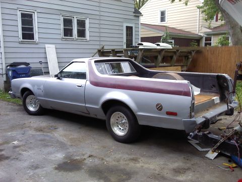 1979 Ford Ranchero - Silver 1979 Ford Ranchero with maroon side stripe and aftermarket wheels.