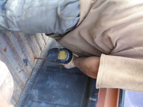 1969 Ford F-250 - Working on the truck bed with a power drill.