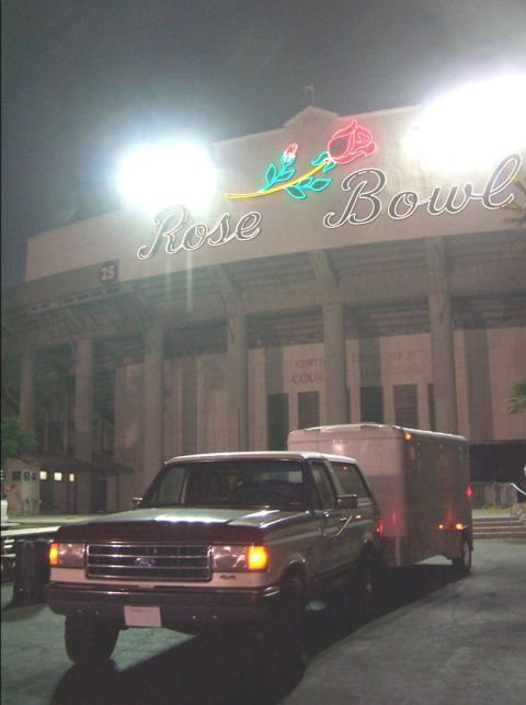1990 Ford Bronco - Ford Bronco towing a trailer outside the Rose Bowl stadium at night.