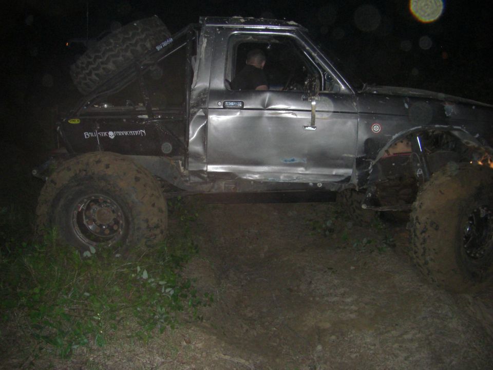 1984 Ford Bronco II, silver, heavily damaged doors and body, off-road tires, spare tire mounted on rear rack