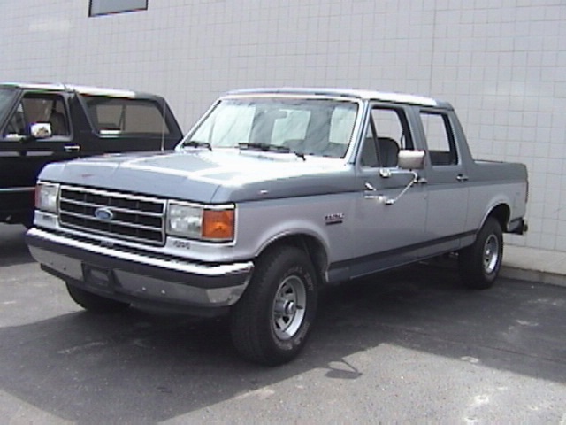 Silver and gray pickup truck, front 3/4 view. Appears to be a 1995 model