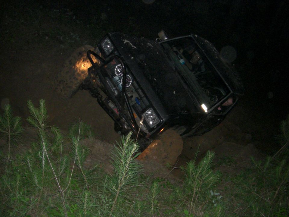 1984 Ford Bronco II stuck in mud off-road at night