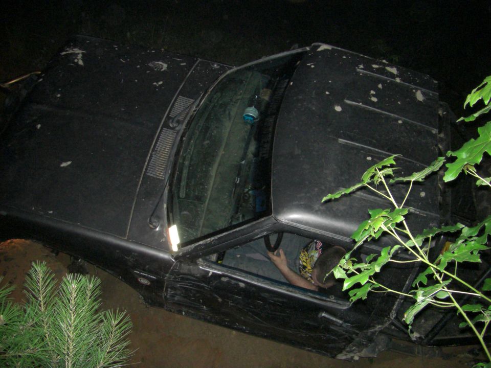 Black SUV interior with driver, seen from above