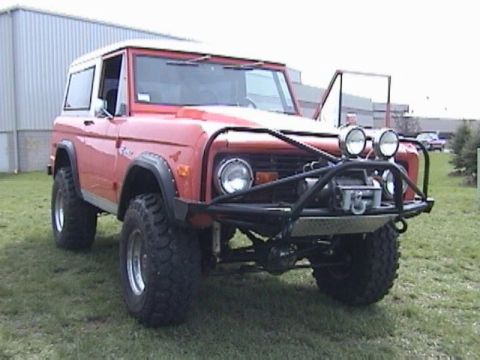 1995 Ford Bronco - This classic Ford Bronco features a lifted suspension and aggressive tires, ready for off-road adventures.
