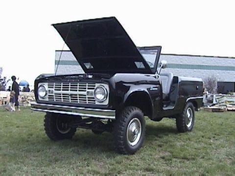 1995 Ford Bronco - This classic Ford Bronco features its hood open, revealing the engine bay.