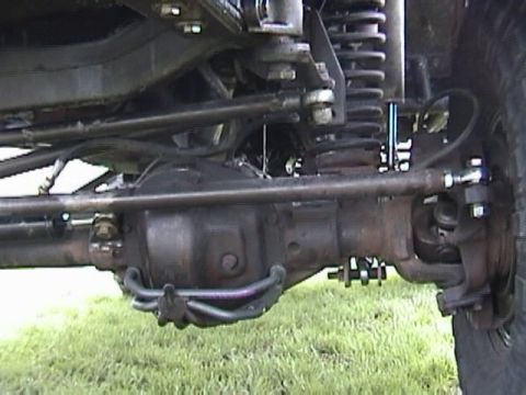 1995 Ford Bronco - Front axle and suspension parts of a vehicle are shown in detail.